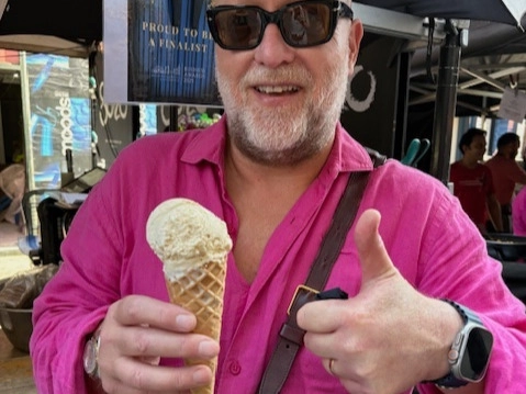 An image showing a man at the Soho Dairy stall eating a Soho Dairy ice cream and giving a thumbs up